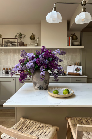 Lilac in a Textured Stone Effect Vase