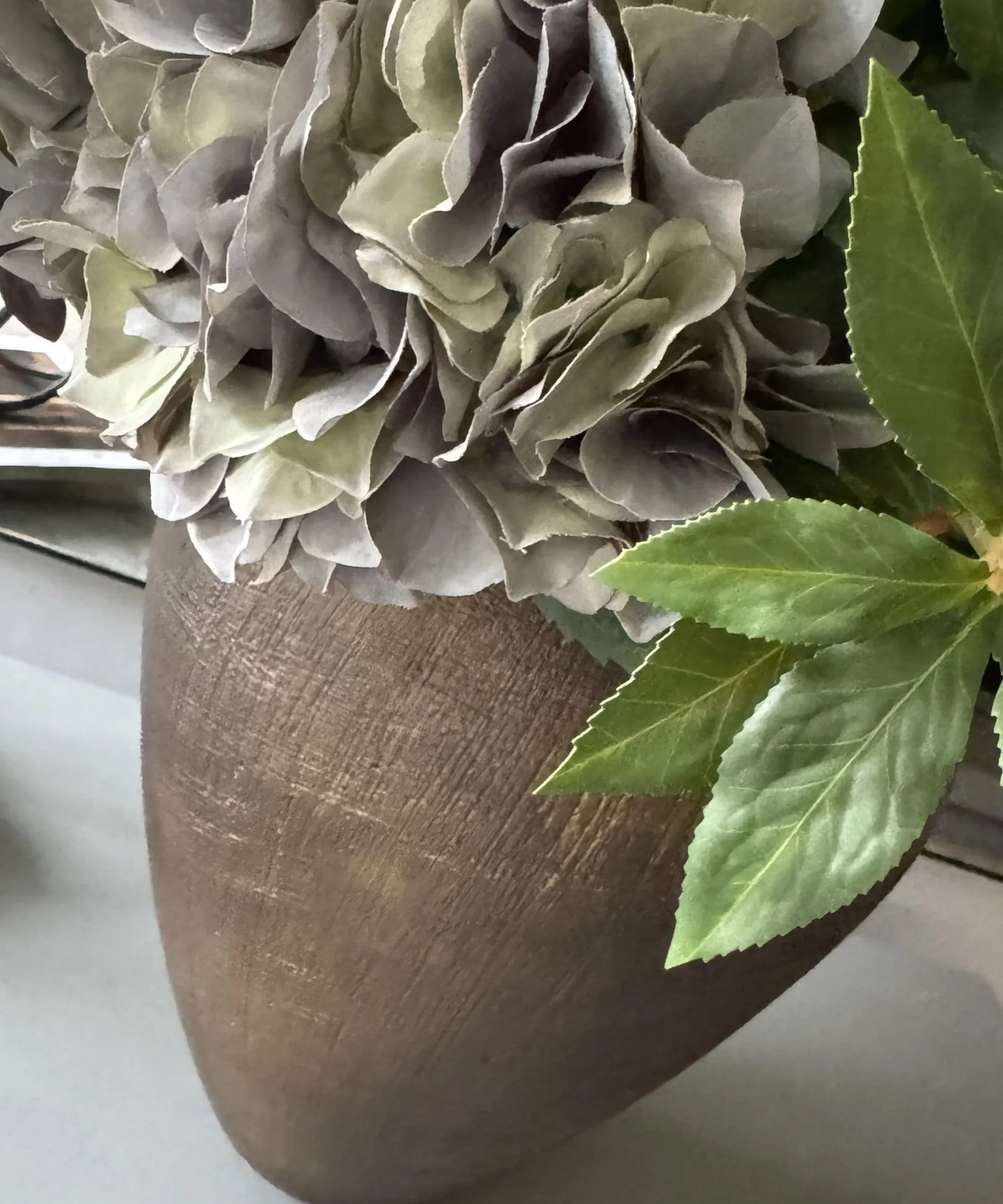 Ranunculus, Roses, Bucida and Eucalyptus in a Textured Bronze Vase RTfact Flowers 