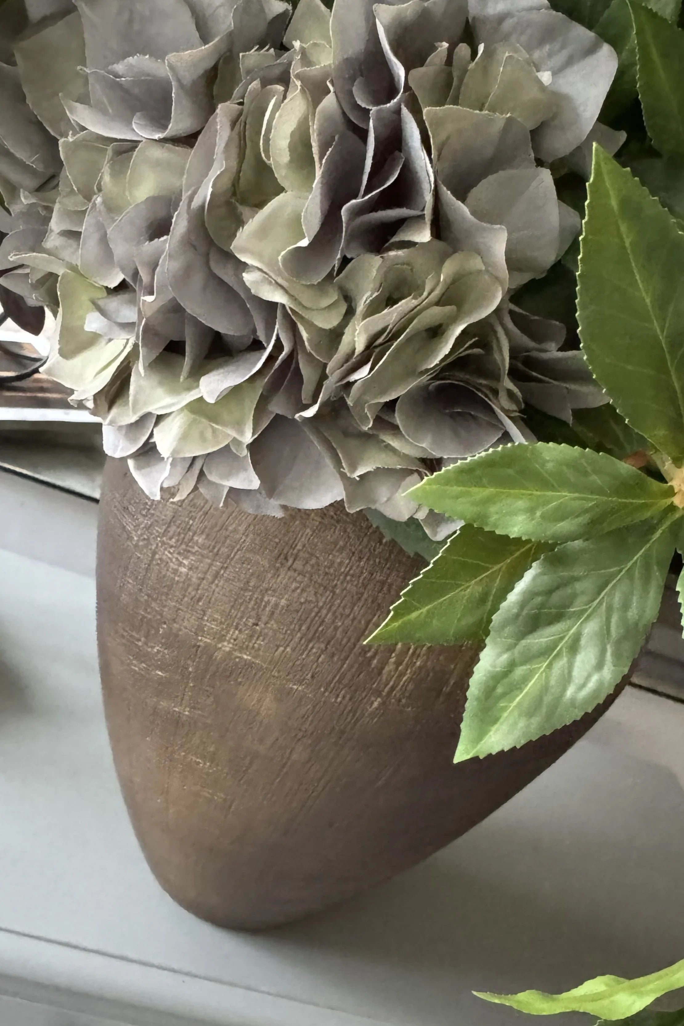 Ranunculus, Roses, Bucida and Eucalyptus in a Textured Bronze Vase RTfact Flowers 