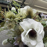 Anemone, Thistle and Eucalyptus in a Blue/Grey Glass Vase