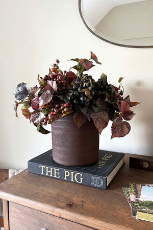 Berries and Ivy in a Dark Brown Clay Pot