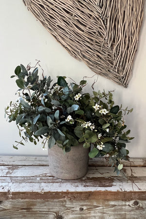 Eucalyptus, Wax Flower and Twigs in a Stone Pot