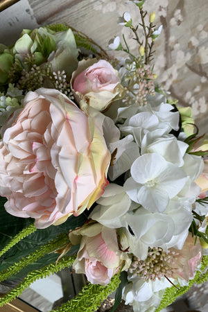 Roses, Hydrangeas and Amaranthus in a leaf lined Cylinder