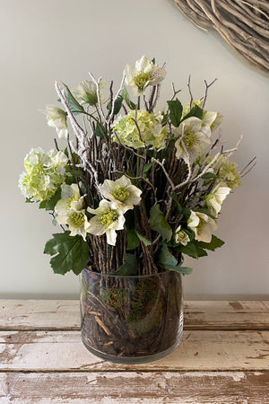 Hellebores, Guelder Rose and Twig in a Glass Cylinder