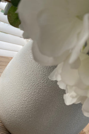Hydrangeas, Hellebores and Roses in a White Ceramic Vase (Medium)