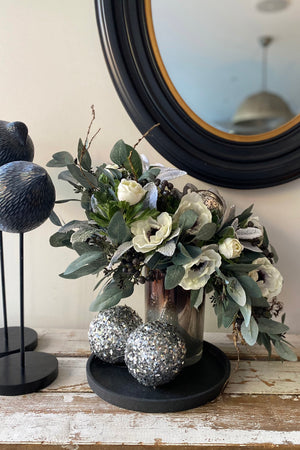 Anemone, Eucalyptus, Berries and Baubles in a Bronze/White Glass Vase