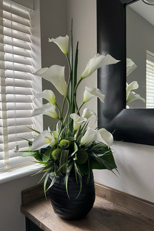 Calla lilies in a Black Carved Glass Vase.