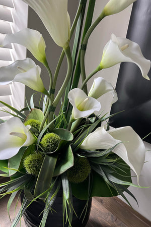 Calla lilies in a Black Carved Glass Vase.