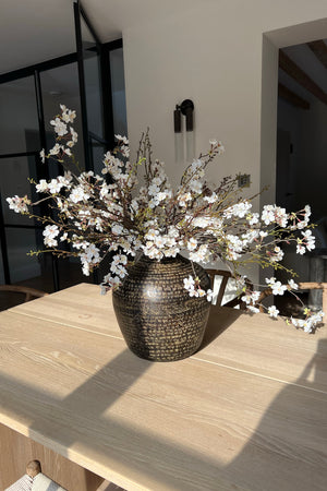 Blossom and Twig in a Brown Metallic Vase