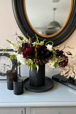 Ranunculus and Magnolia in a Black Stone Vase