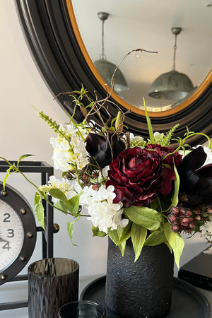 Ranunculus and Magnolia in a Black Stone Vase