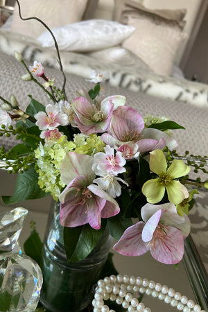 Hellebore, Guelder Rose and Blossom in a Leaf Lined Vase