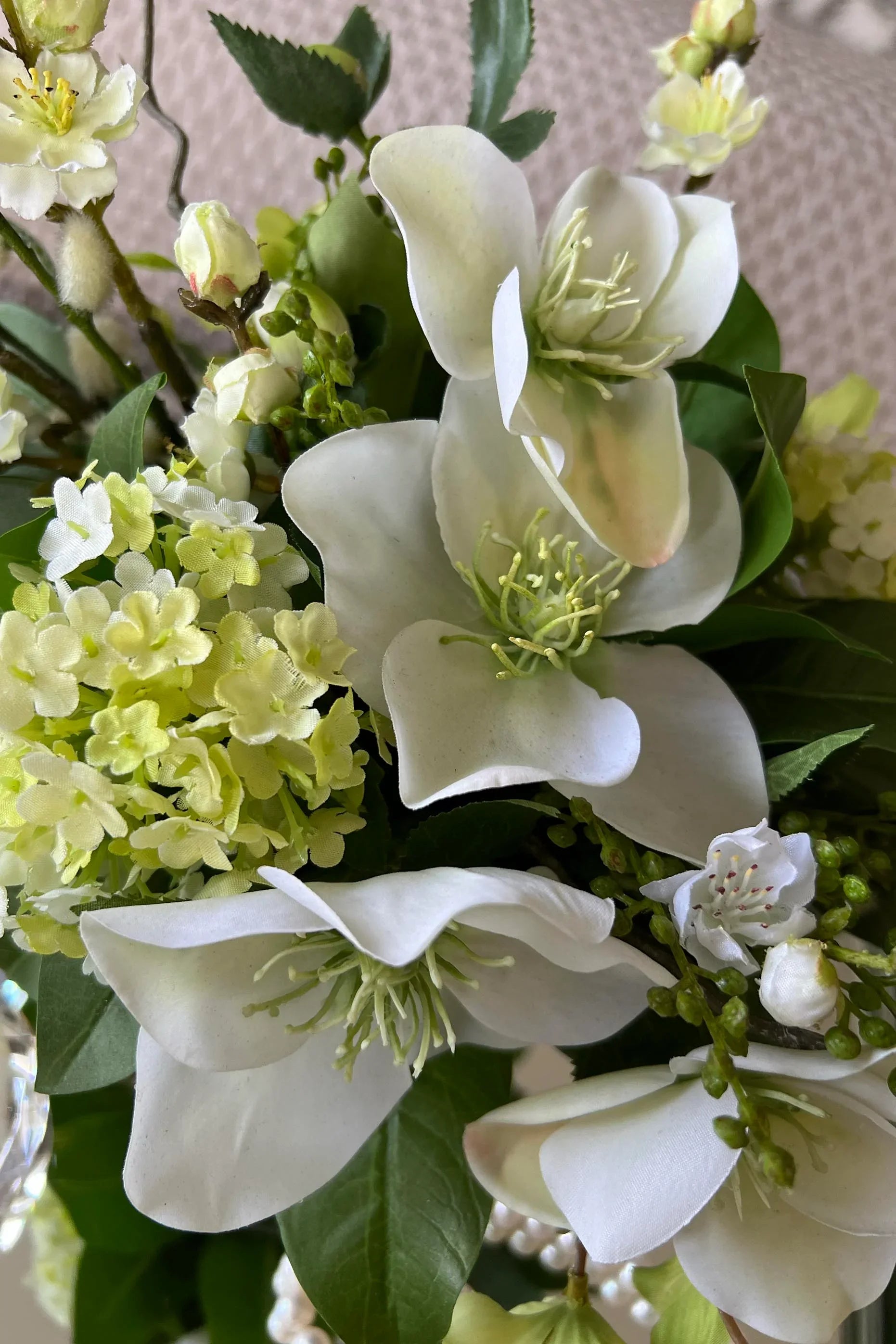 Hellebore, Guelder Rose and Blossom in a Leaf Lined Vase (Cream) RTfact Flowers 